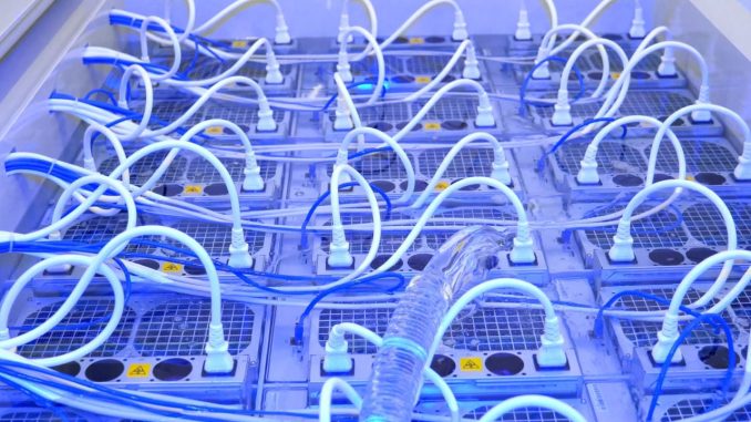 Large Immersion Cooled Crypto Mining Farms to Extract Bitcoin in Large Immersion Cooled Crypto Mining Farms to Extract Bitcoin in Middle East Desert
