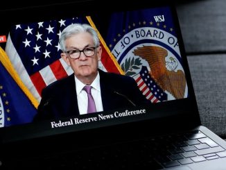 Bitcoin Rises as Fed Holds Rates Steady